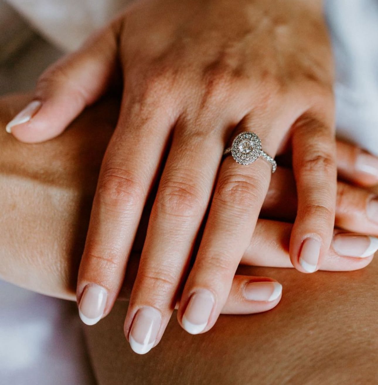 womans lands overlapping showing new manicure / nails